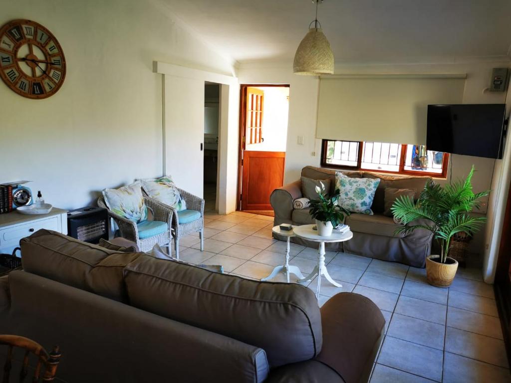 Comfortable living area with views through to the kitchen at Sipreslaan